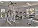 Well-equipped gym with modern exercise machines, weights, and plenty of natural light at 601 Hillside Dr. N # 3704, North Myrtle Beach, SC 29582