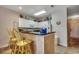 Well-equipped kitchen with white cabinets, counter seating, and modern appliances at 601 Hillside Dr. N # 3704, North Myrtle Beach, SC 29582