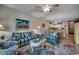 Open floorplan features comfortable sofas, a dining area, and access to the kitchen at 601 Hillside Dr. N # 3704, North Myrtle Beach, SC 29582