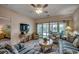 Comfortable living room with a TV and stylish furniture, next to an inviting sunroom at 601 Hillside Dr. N # 3704, North Myrtle Beach, SC 29582