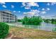 Scenic view of a pond with a fountain and white picket fence surrounding, adding elegance and a touch of privacy at 601 Hillside Dr. N # 3704, North Myrtle Beach, SC 29582
