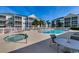 Inviting outdoor pool and hot tub area with comfortable lounge chairs and tables for relaxation at 601 Hillside Dr. N # 3704, North Myrtle Beach, SC 29582