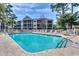 Refreshing outdoor pool surrounded by lounge chairs and lush greenery, providing a relaxing oasis at 601 Hillside Dr. N # 3704, North Myrtle Beach, SC 29582