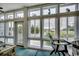 Bright sunroom featuring walls of windows that look out onto the surrounding landscape and letting in an abundance of natural light at 601 Hillside Dr. N # 3704, North Myrtle Beach, SC 29582
