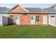 Charming backyard featuring two entrances and a patch of green grass at 603 Wave Rider Ln. # 603, North Myrtle Beach, SC 29582