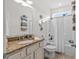 Bathroom with granite countertop, tiled floor, shower/tub, and towel racks at 603 Wave Rider Ln. # 603, North Myrtle Beach, SC 29582