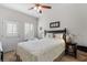 Bedroom with a ceiling fan, exterior door and side table with lamp at 603 Wave Rider Ln. # 603, North Myrtle Beach, SC 29582