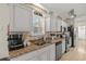 Well-equipped kitchen showcasing granite countertops, stainless appliances, and white cabinets at 603 Wave Rider Ln. # 603, North Myrtle Beach, SC 29582