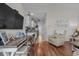 Cozy living room with dining table and chairs with hardwood flooring and natural light at 603 Wave Rider Ln. # 603, North Myrtle Beach, SC 29582