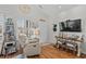 Inviting living room with hardwood floors, white walls, and charming beach decor accents at 603 Wave Rider Ln. # 603, North Myrtle Beach, SC 29582