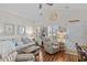 Bright living room with vaulted ceilings, comfortable seating, and coastal-themed decorations at 603 Wave Rider Ln. # 603, North Myrtle Beach, SC 29582