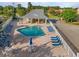 Aerial shot of a community pool featuring a shaded pavilion and ample seating for residents at 603 Wave Rider Ln. # 603, North Myrtle Beach, SC 29582