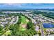 Scenic aerial view of the community with lush greenery, a golf course, and a glimpse of the ocean in the distance at 6203 Catalina Dr. # 212, North Myrtle Beach, SC 29582
