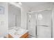 Bright bathroom featuring a single sink vanity and a walk-in shower with clear sliding doors at 6203 Catalina Dr. # 212, North Myrtle Beach, SC 29582