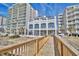 A building with a wooden walkway leading up to it, offering easy access to the building and beautiful views at 6203 Catalina Dr. # 212, North Myrtle Beach, SC 29582