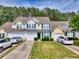 Inviting townhome with manicured lawn, attached garages, and charming curb appeal at 6203 Catalina Dr. # 212, North Myrtle Beach, SC 29582