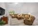 Comfortable living room features neutral colors, plush furniture, and sliding glass doors to a deck at 6203 Catalina Dr. # 212, North Myrtle Beach, SC 29582