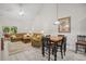 Open living and dining area featuring a vaulted ceiling, comfortable seating, and stylish decor at 6203 Catalina Dr. # 212, North Myrtle Beach, SC 29582