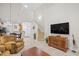 Open concept living area with hardwood floors, staircase, and access to the kitchen and dining at 6203 Catalina Dr. # 212, North Myrtle Beach, SC 29582