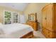 Spacious main bedroom with natural light, a comfortable bed, and ample closet space at 6203 Catalina Dr. # 212, North Myrtle Beach, SC 29582