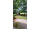 Serene backyard with mature trees, a lush green lawn, and a private setting at 700 Two Rivers Ct., Myrtle Beach, SC 29579