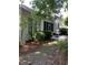 Backyard featuring a small patio with outdoor furniture and lush foliage at 700 Two Rivers Ct., Myrtle Beach, SC 29579
