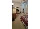 Bedroom with neutral walls, carpet, and a ceiling fan near a large window with shutters at 700 Two Rivers Ct., Myrtle Beach, SC 29579