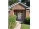 Charming brick home with a welcoming front porch and well-manicured landscaping at 700 Two Rivers Ct., Myrtle Beach, SC 29579