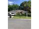 Charming single-story brick home with lush landscaping and a well-manicured front lawn at 700 Two Rivers Ct., Myrtle Beach, SC 29579