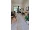Open living room features neutral tones, tile floors, a ceiling fan, and lots of natural light at 700 Two Rivers Ct., Myrtle Beach, SC 29579