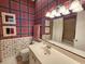 Charming bathroom with unique wallpaper and plenty of counter space at 701 Norris Dr., Pawleys Island, SC 29585