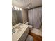 Cozy bathroom with single sink vanity and striped shower curtain at 701 Norris Dr., Pawleys Island, SC 29585