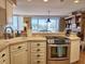 Bright kitchen with stainless steel appliances and beach views from the sink at 701 Norris Dr., Pawleys Island, SC 29585