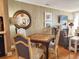 Inviting living space with wooden floors, a round mirror, and comfortable seating arrangements at 701 Norris Dr., Pawleys Island, SC 29585