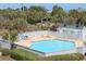 Inviting outdoor pool with lounge chairs, perfect for relaxation at 701 Norris Dr., Pawleys Island, SC 29585