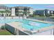 Community pool surrounded by lounge chairs, providing a refreshing recreational space at 701 Norris Dr., Pawleys Island, SC 29585