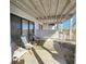 Relaxing porch with a hammock and chairs, perfect for enjoying the outdoors at 701 Norris Dr., Pawleys Island, SC 29585