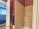 Shower with tile surround in uniquely decorated bathroom at 701 Norris Dr., Pawleys Island, SC 29585