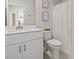 Clean bathroom featuring a vanity with a white countertop, a toilet, and decorative accents at 7094 Watercress St, Myrtle Beach, SC 29579