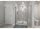 Modern bathroom with glass-enclosed shower, tile surround, and a built-in bench at 7094 Watercress St, Myrtle Beach, SC 29579