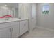 Bright bathroom featuring double vanity with white cabinets and a framed mirror at 7094 Watercress St, Myrtle Beach, SC 29579