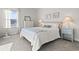 Inviting bedroom featuring plush carpeting, neutral tones, natural lighting, and comfortable furnishings at 7094 Watercress St, Myrtle Beach, SC 29579