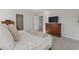 Bedroom with a bed, dresser, and TV, offering a cozy and comfortable space to unwind at 7094 Watercress St, Myrtle Beach, SC 29579