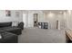 Cozy loft space featuring gray sectional sofa and natural light at 7094 Watercress St, Myrtle Beach, SC 29579