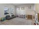 Another view of the playroom featuring a comfy modular couch, play tent, and natural light at 7094 Watercress St, Myrtle Beach, SC 29579