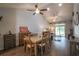 Dining area with vaulted ceilings, a wooden table, and seamless connection to the living room at 797 Salerno Circle # C, Myrtle Beach, SC 29579