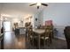 Dining room with wood floors and a view of the kitchen and breakfast bar area at 797 Salerno Circle # C, Myrtle Beach, SC 29579