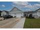 Inviting home with a two-car garage, manicured lawn, and gray siding at 797 Salerno Circle # C, Myrtle Beach, SC 29579
