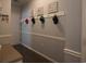 Hallway with coat racks and hat storage above bench with cushioned seating at 797 Salerno Circle # C, Myrtle Beach, SC 29579