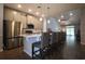 Open kitchen featuring a large island with seating, stainless steel appliances, and pendant lighting at 797 Salerno Circle # C, Myrtle Beach, SC 29579